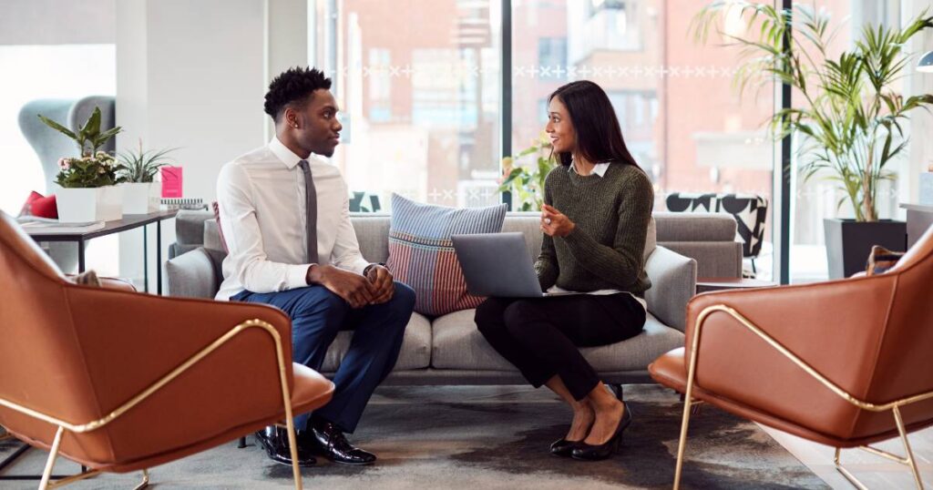 Two people in an interview after company used effective social media for talent recruitment strategy.