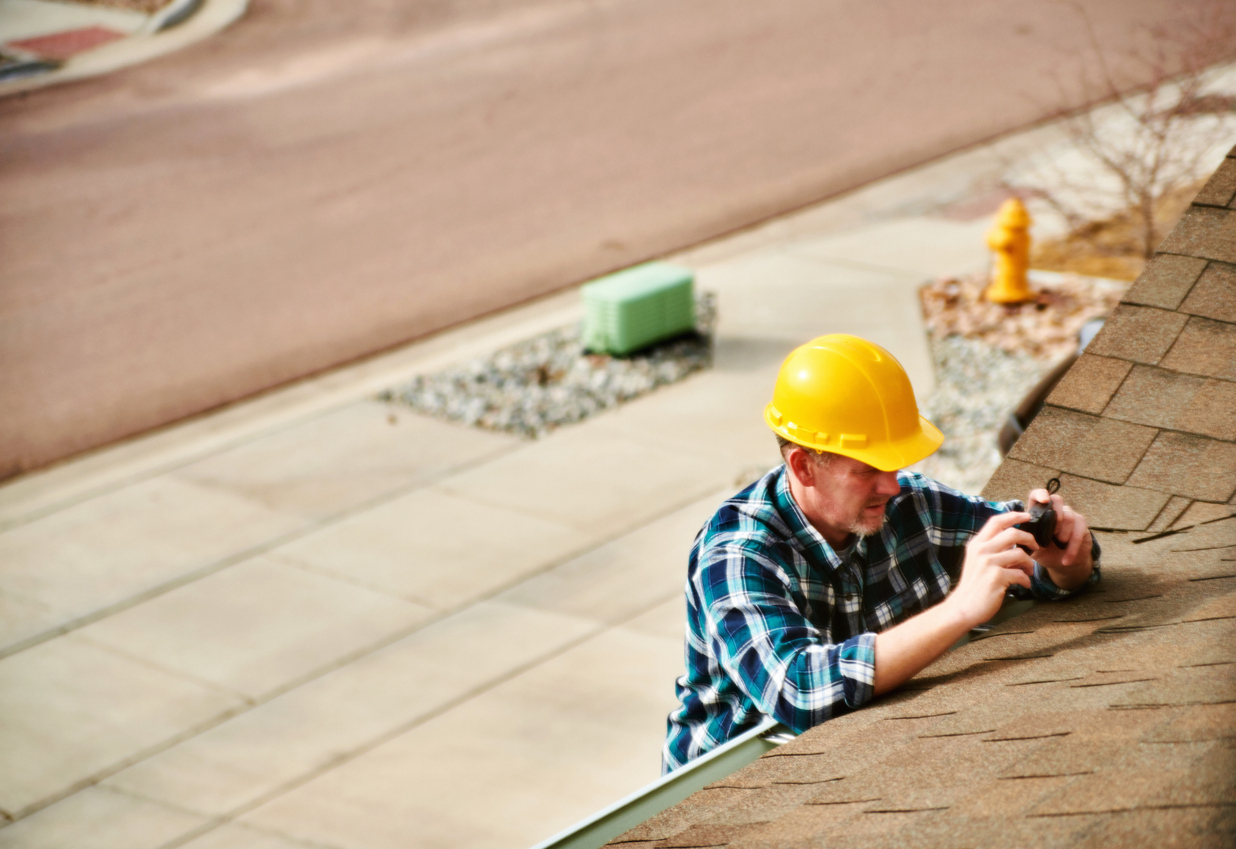 Taking pictures for contractor's social media on a roof